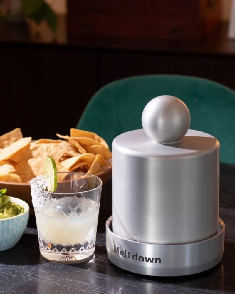 Aluminum Chubby Meltdown ice press on table with margarita glass and tortilla chips