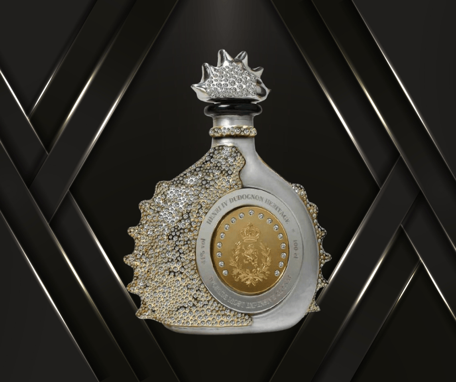 An ornate, crystal liquor bottle with gold and silver accents, encrusted with jewels, stands against a background of black and gold diagonal lines. The bottle features a unique, asymmetrical design with a decorative cap.